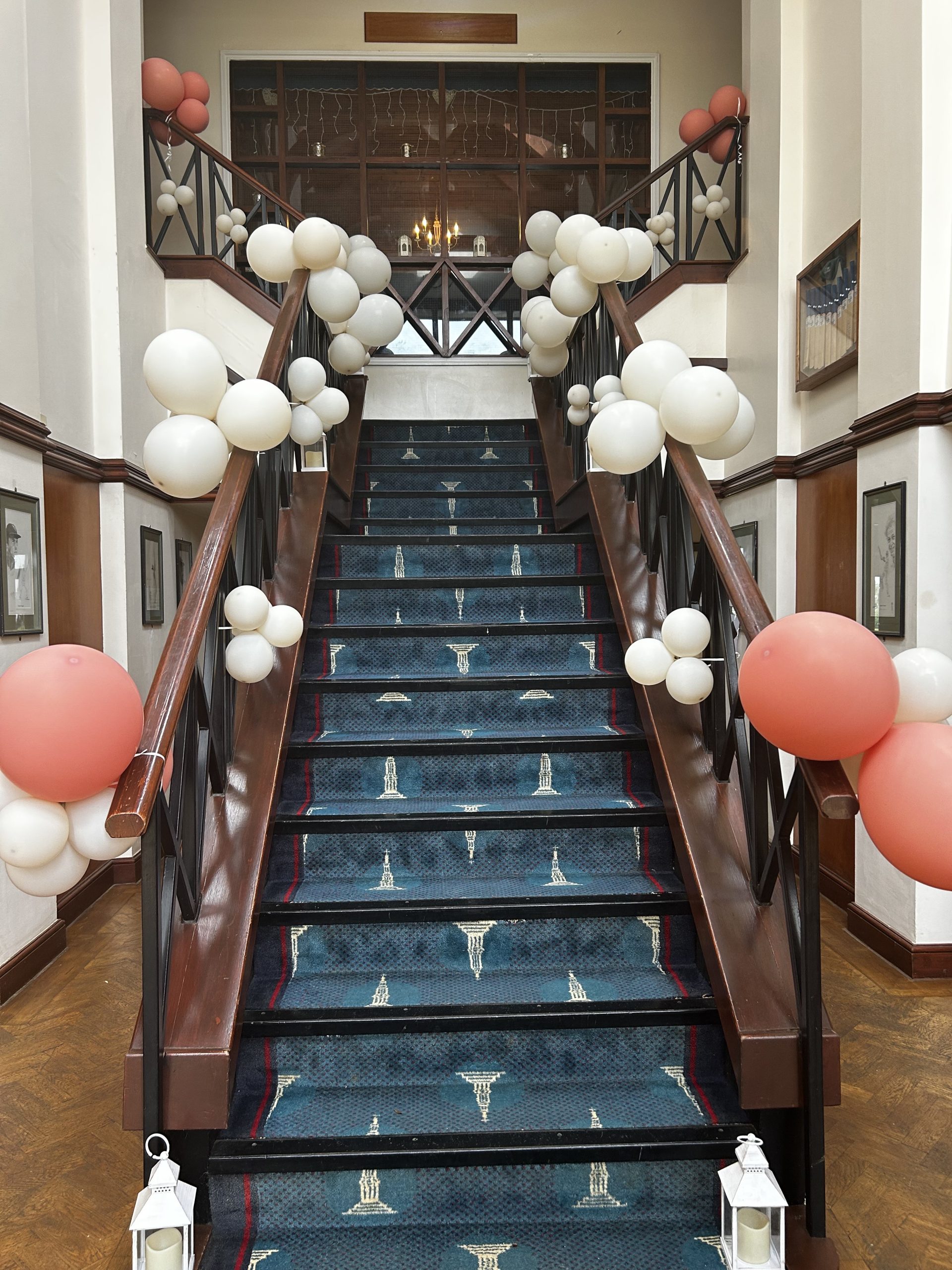 PromStairDecor The stairs at The Pavilion decorated with white and coral balloons
