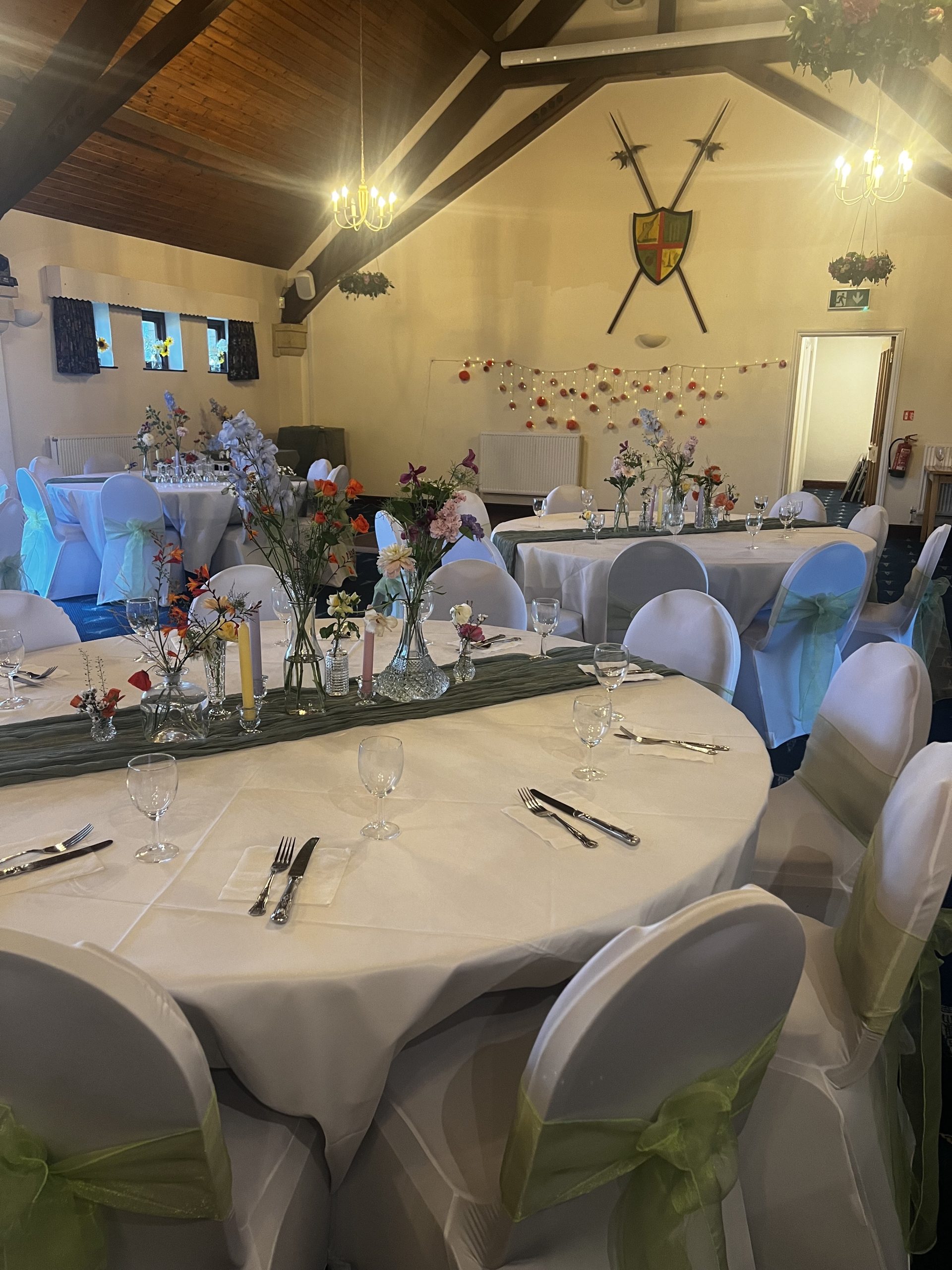 RetirementImg A dining room at The Pavilion decorated with flowers and a white table cloth